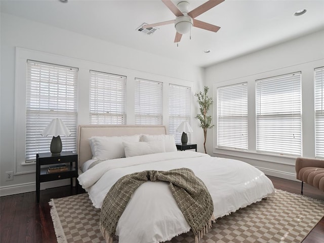 bedroom featuring ceiling fan and dark hardwood / wood-style floors