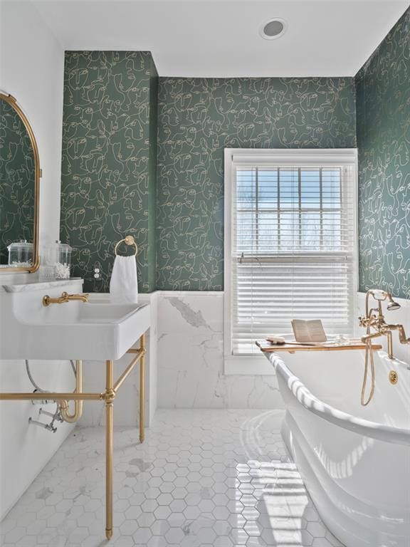 bathroom featuring a bath and tile patterned floors