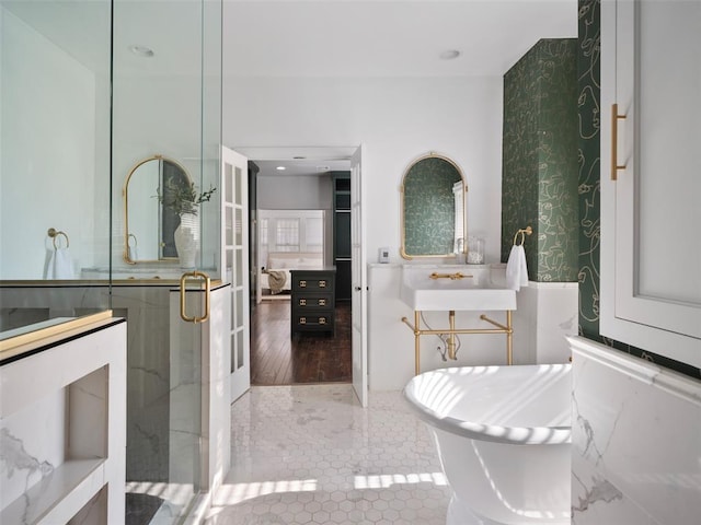 bathroom with sink, independent shower and bath, and tile patterned flooring