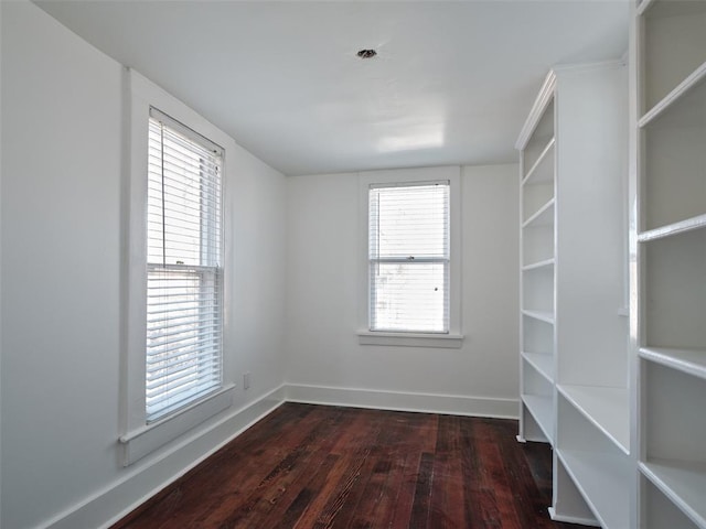 walk in closet featuring dark hardwood / wood-style flooring