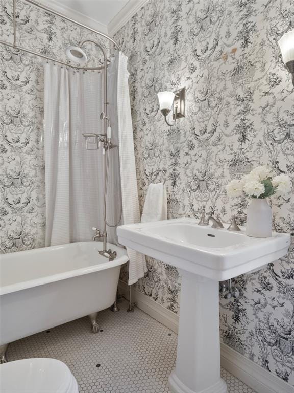 bathroom featuring tile patterned flooring, crown molding, shower / bathtub combination with curtain, and toilet