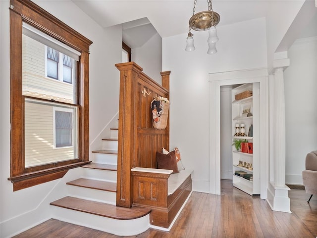 stairs with hardwood / wood-style floors