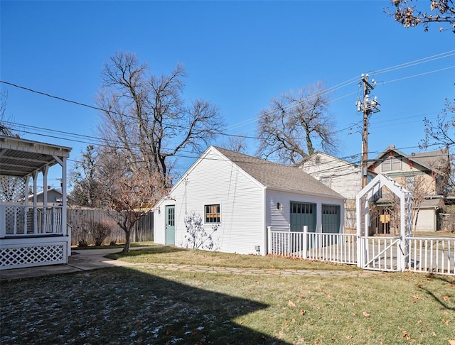 exterior space with a garage and a yard