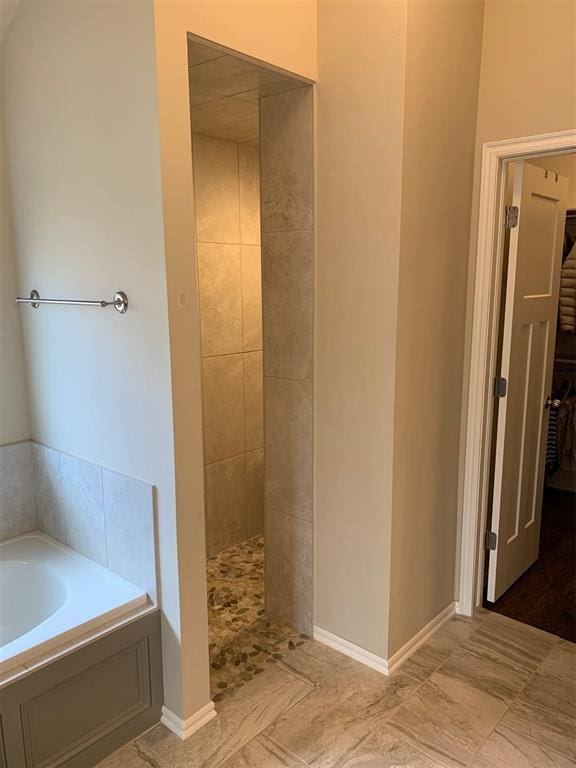 bathroom with separate shower and tub