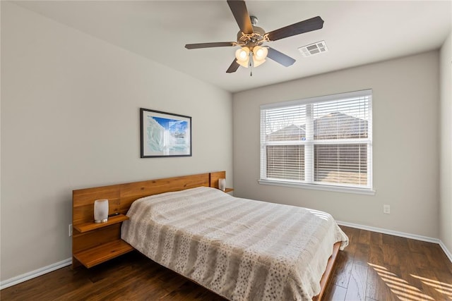 bedroom featuring ceiling fan and dark hardwood / wood-style flooring