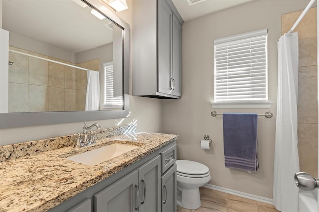 bathroom featuring vanity, toilet, and curtained shower