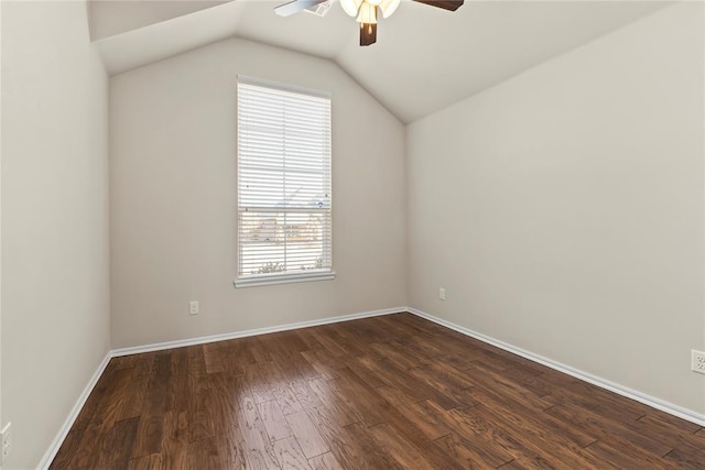 additional living space featuring lofted ceiling, dark hardwood / wood-style floors, and ceiling fan