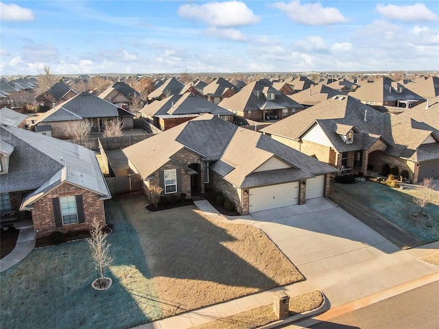 birds eye view of property with a residential view