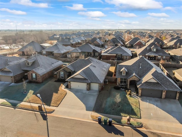 birds eye view of property with a residential view