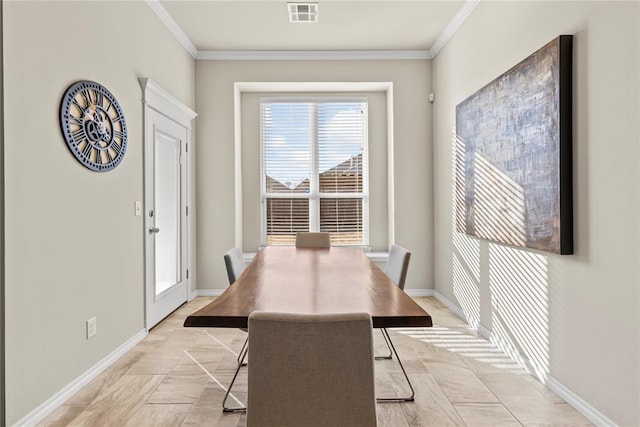 dining room with ornamental molding, visible vents, and baseboards