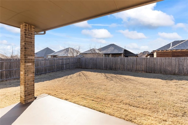 view of yard featuring a patio and a fenced backyard