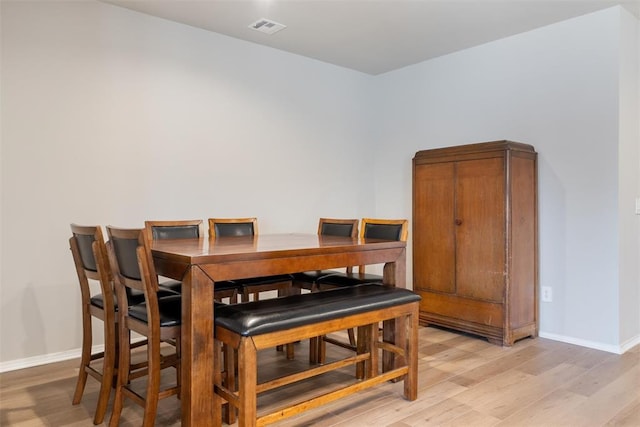 dining area with light wood-type flooring