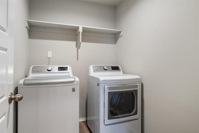 clothes washing area with independent washer and dryer