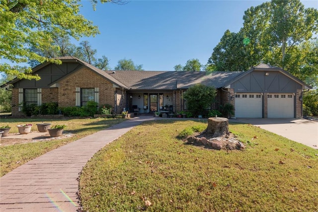 ranch-style home featuring a garage and a front lawn