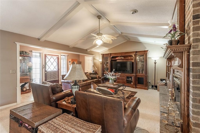 living room with a fireplace, vaulted ceiling with beams, ceiling fan, light carpet, and a textured ceiling