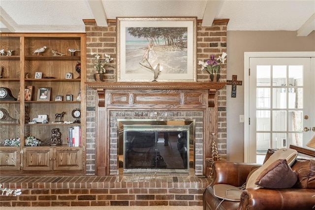 interior space featuring a brick fireplace and beam ceiling