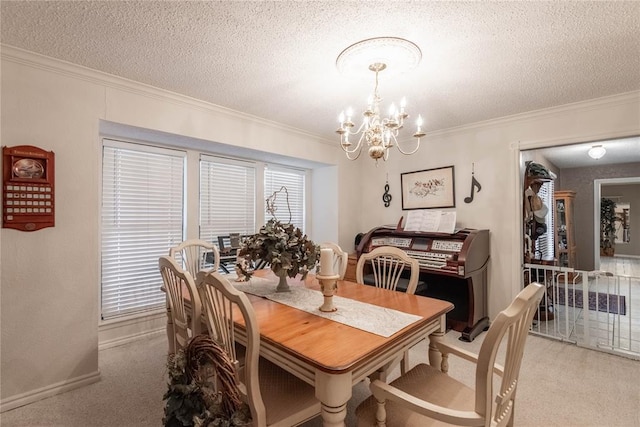 dining space featuring ornamental molding, light carpet, a notable chandelier, and a textured ceiling