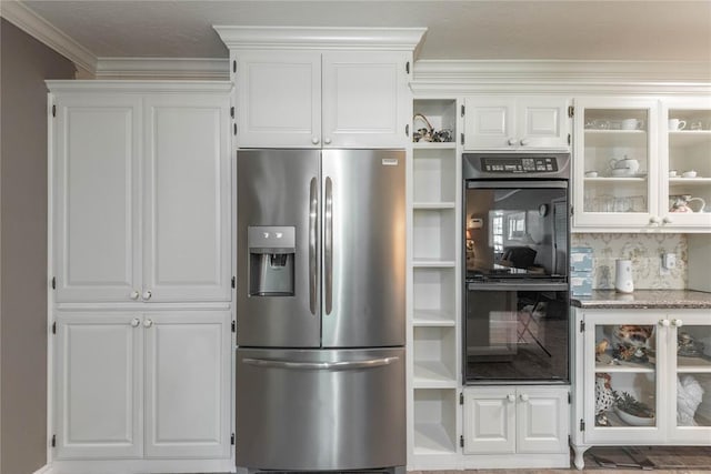 kitchen with double oven, white cabinetry, crown molding, and stainless steel fridge with ice dispenser