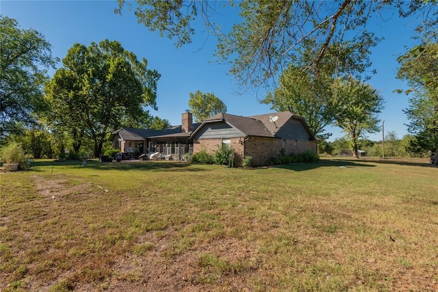 exterior space with a yard