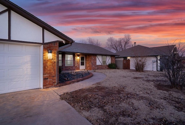 property exterior at dusk with a garage