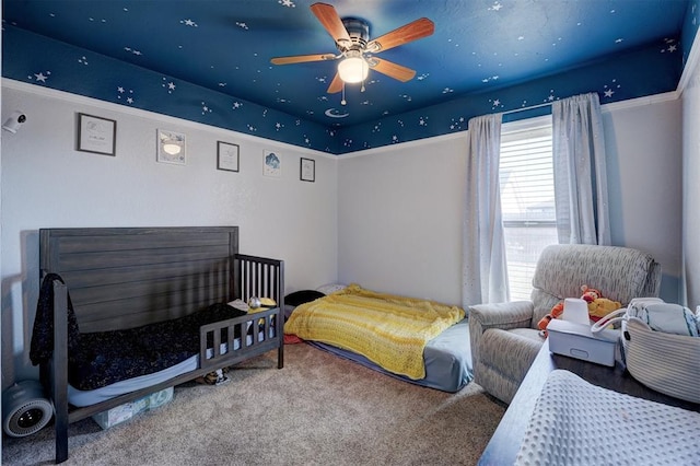 carpeted bedroom featuring ceiling fan