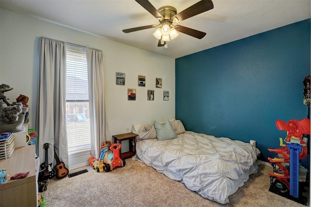 carpeted bedroom featuring ceiling fan