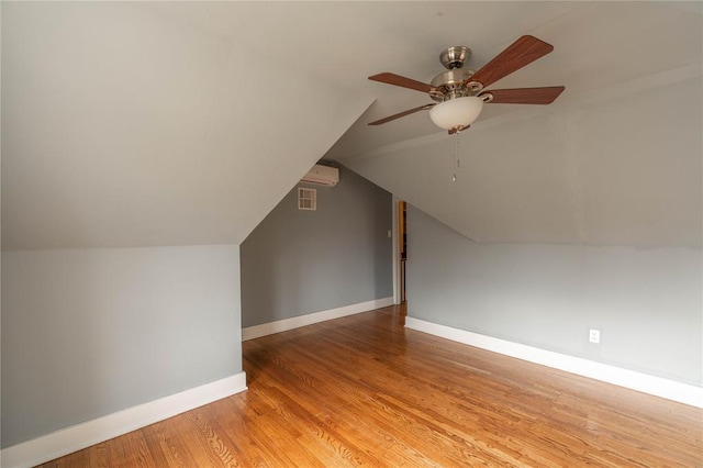 bonus room with light hardwood / wood-style flooring, ceiling fan, and vaulted ceiling