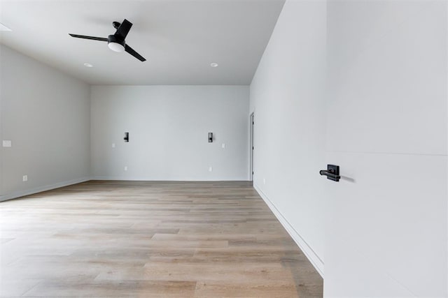 spare room with light hardwood / wood-style flooring and ceiling fan