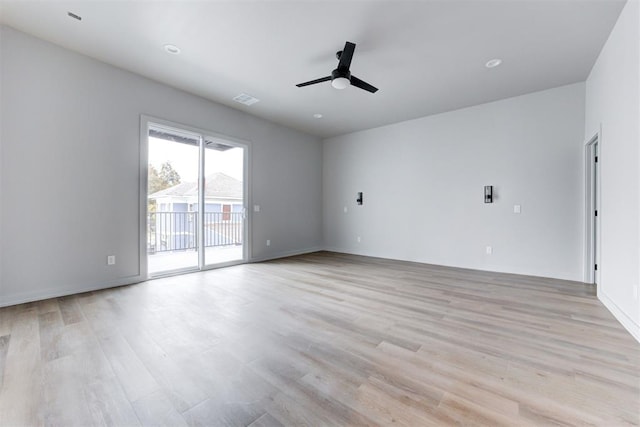 spare room featuring ceiling fan and light wood-type flooring