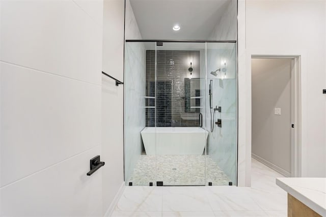 bathroom featuring an enclosed shower and vanity