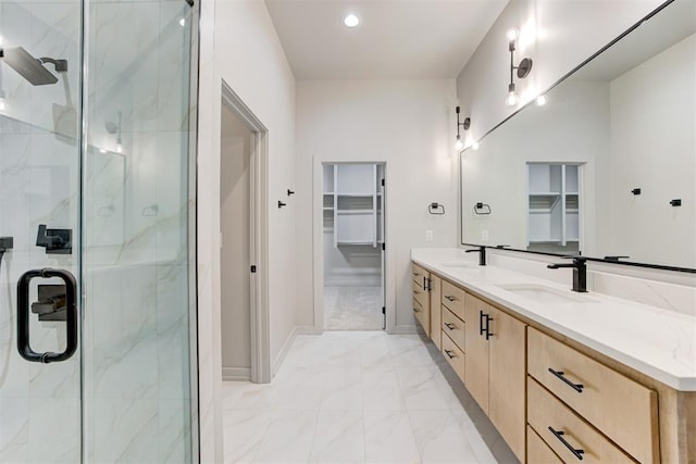 bathroom featuring vanity and a shower with shower door