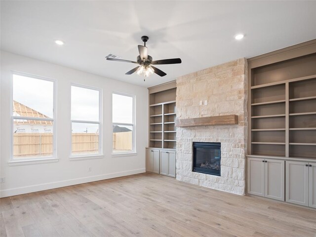 unfurnished living room featuring a fireplace, recessed lighting, ceiling fan, light wood-type flooring, and baseboards