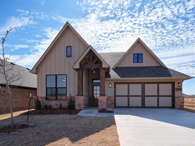 view of front facade with driveway, brick siding, roof with shingles, and board and batten siding