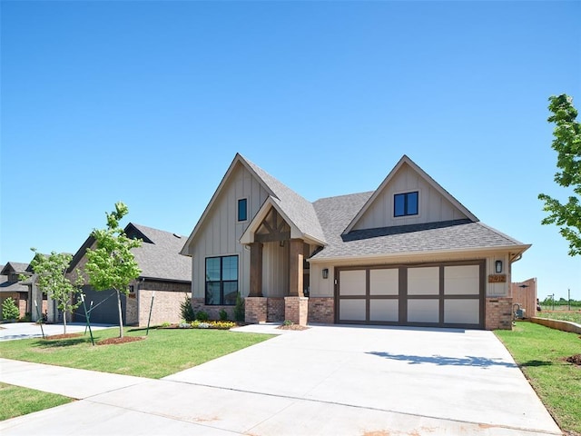 7912 NW 163rd St, Edmond, OK 73012 - modern farmhouse style home with concrete driveway, board and batten siding, a front yard, brick siding, and a shingled roof