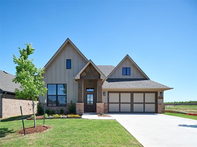 7912 NW 163rd St, Edmond, OK 73012 - modern farmhouse style home with board and batten siding, concrete driveway, a front yard, roof with shingles, and brick siding