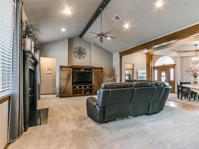 living room with high vaulted ceiling, light carpet, ceiling fan with notable chandelier, beamed ceiling, and ornate columns