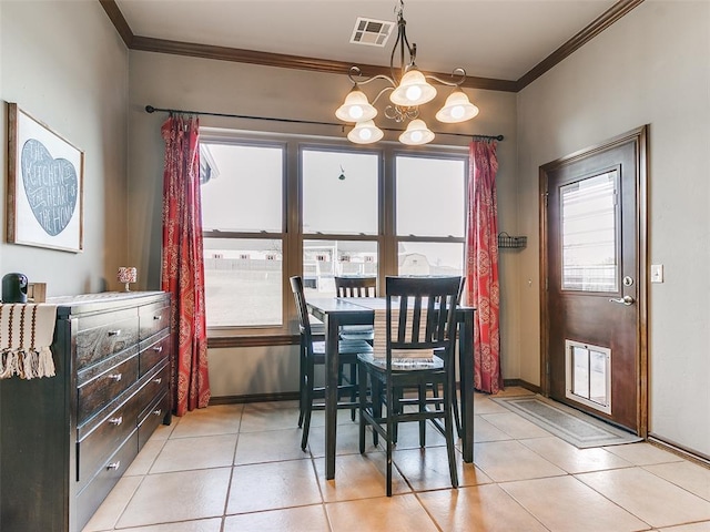 tiled dining room with ornamental molding and a notable chandelier