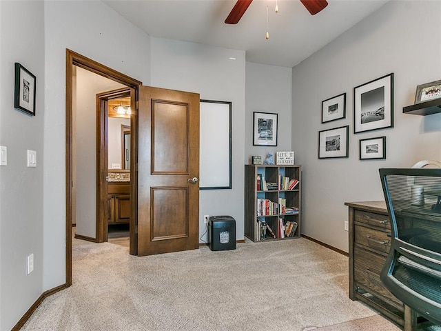 office area with light carpet and ceiling fan