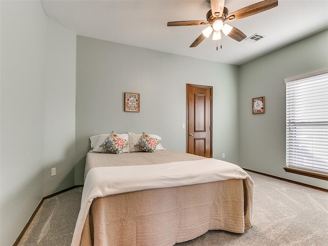 carpeted bedroom with ceiling fan