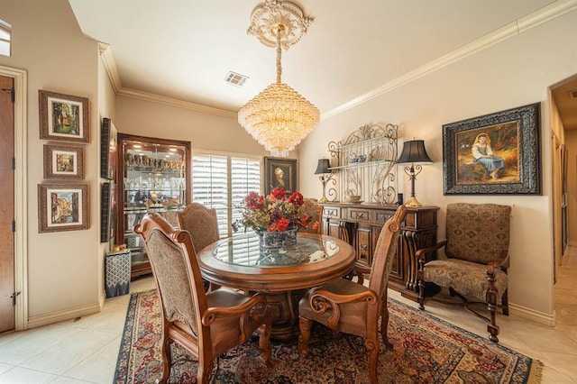 dining room featuring ornamental molding, light tile patterned flooring, and a notable chandelier