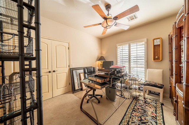 home office with visible vents and a ceiling fan