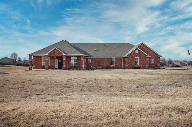 ranch-style home with a front yard