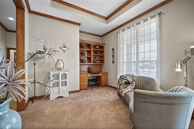 sitting room with a tray ceiling, crown molding, and light colored carpet