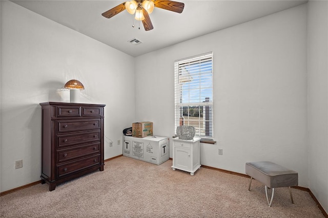 interior space with ceiling fan