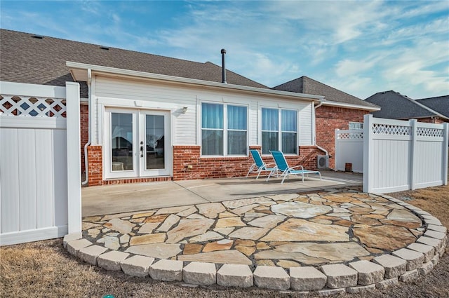 back of property featuring a patio area