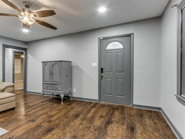 foyer featuring dark hardwood / wood-style floors and ceiling fan