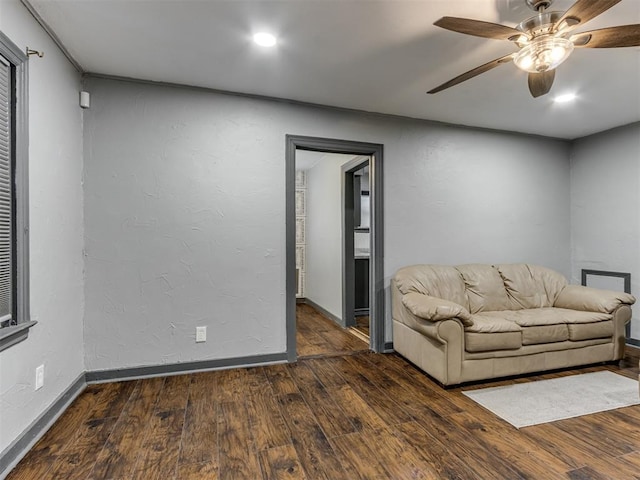 unfurnished living room featuring dark hardwood / wood-style floors and ceiling fan