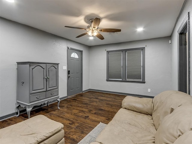 living room with dark hardwood / wood-style floors and ceiling fan