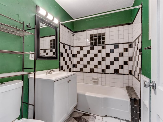 full bathroom with vanity, tiled shower / bath combo, tile patterned floors, and toilet