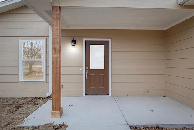 doorway to property with a patio area